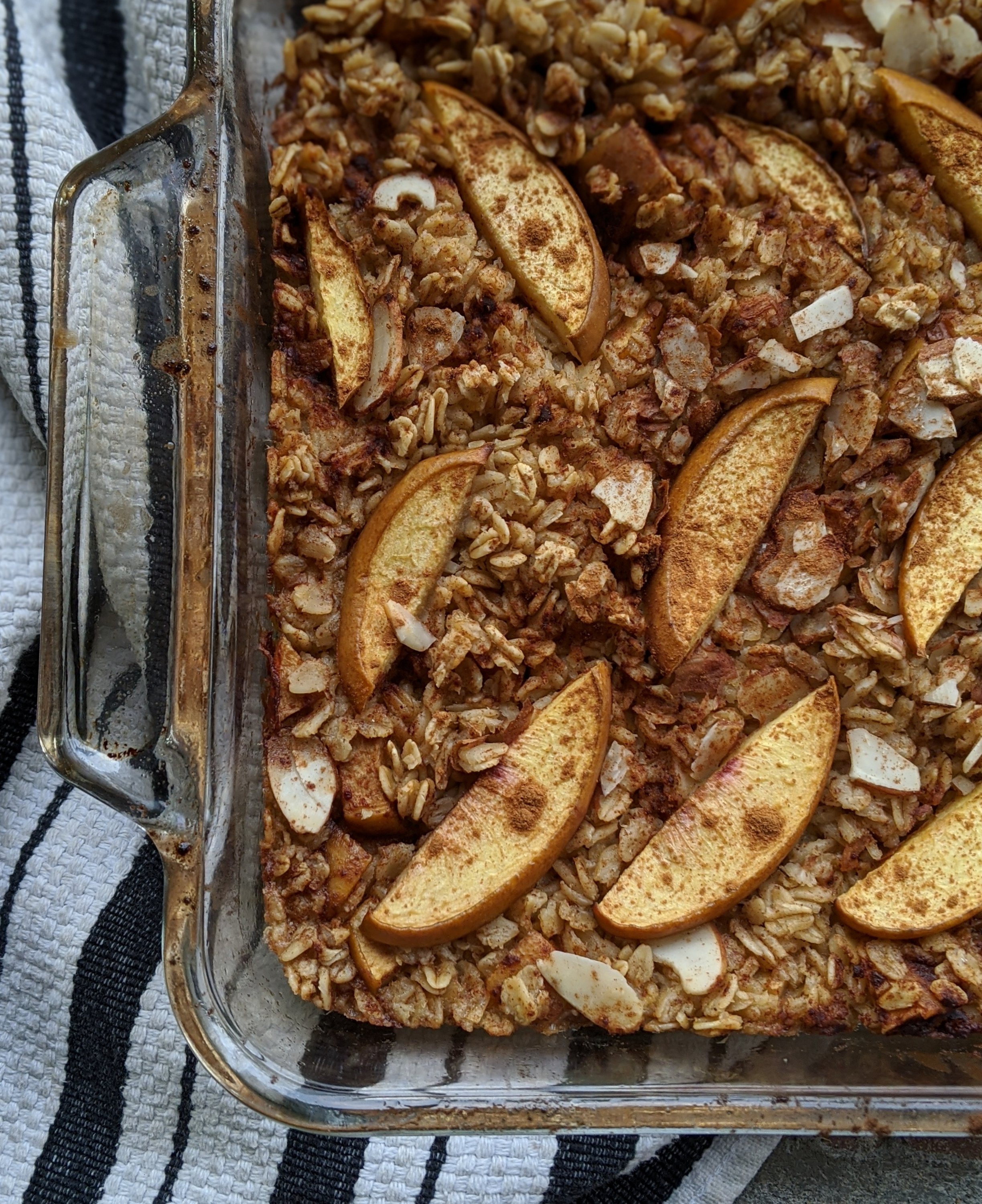 baked oatmeal with peaches in a baking dish oven oatmeal with summer peaches and cinnamon