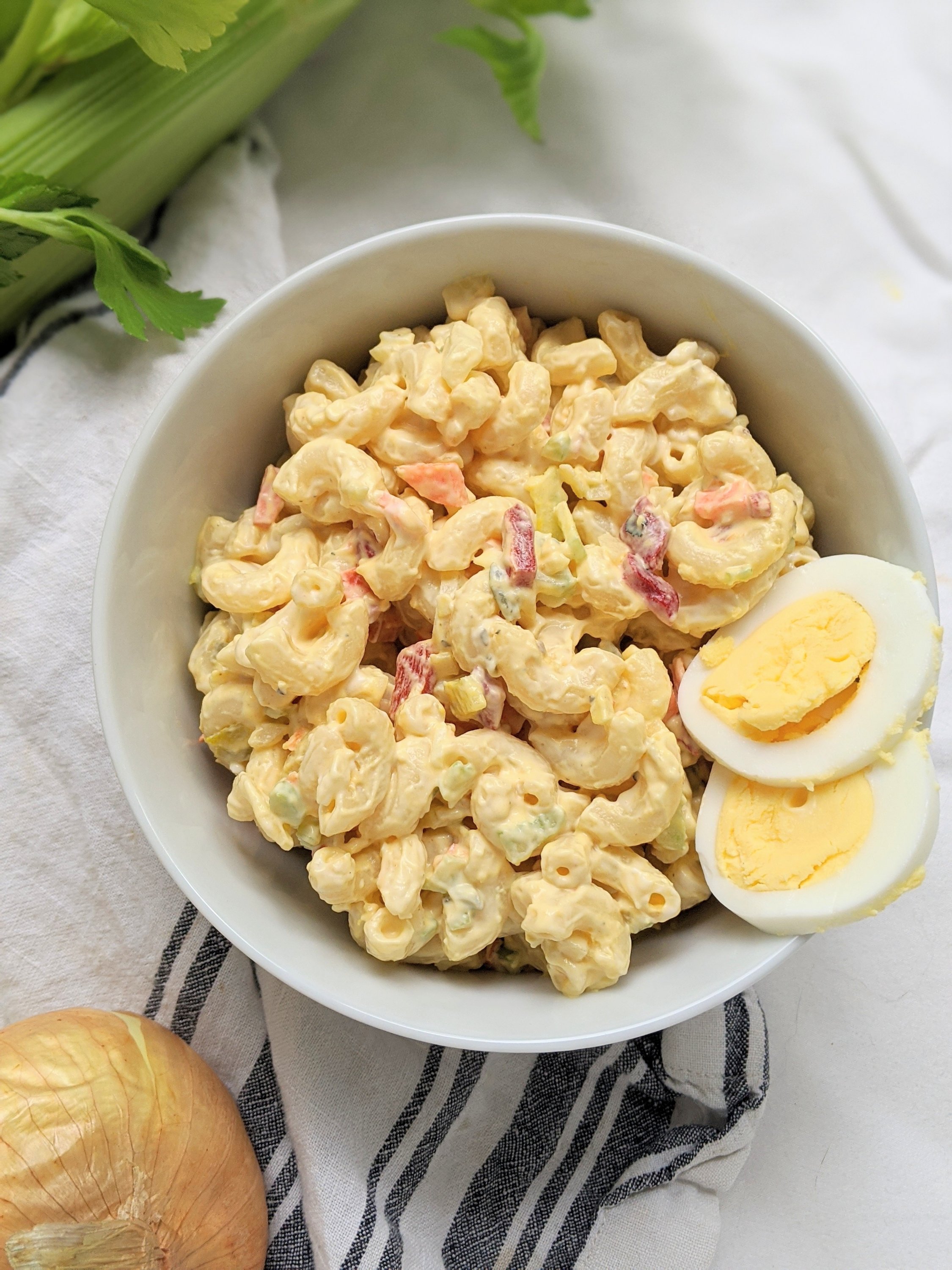 macaroni salad with hardboiled eggs carrots bell peppers celery mayo mustard relish and apple cider vinegar pasta salad