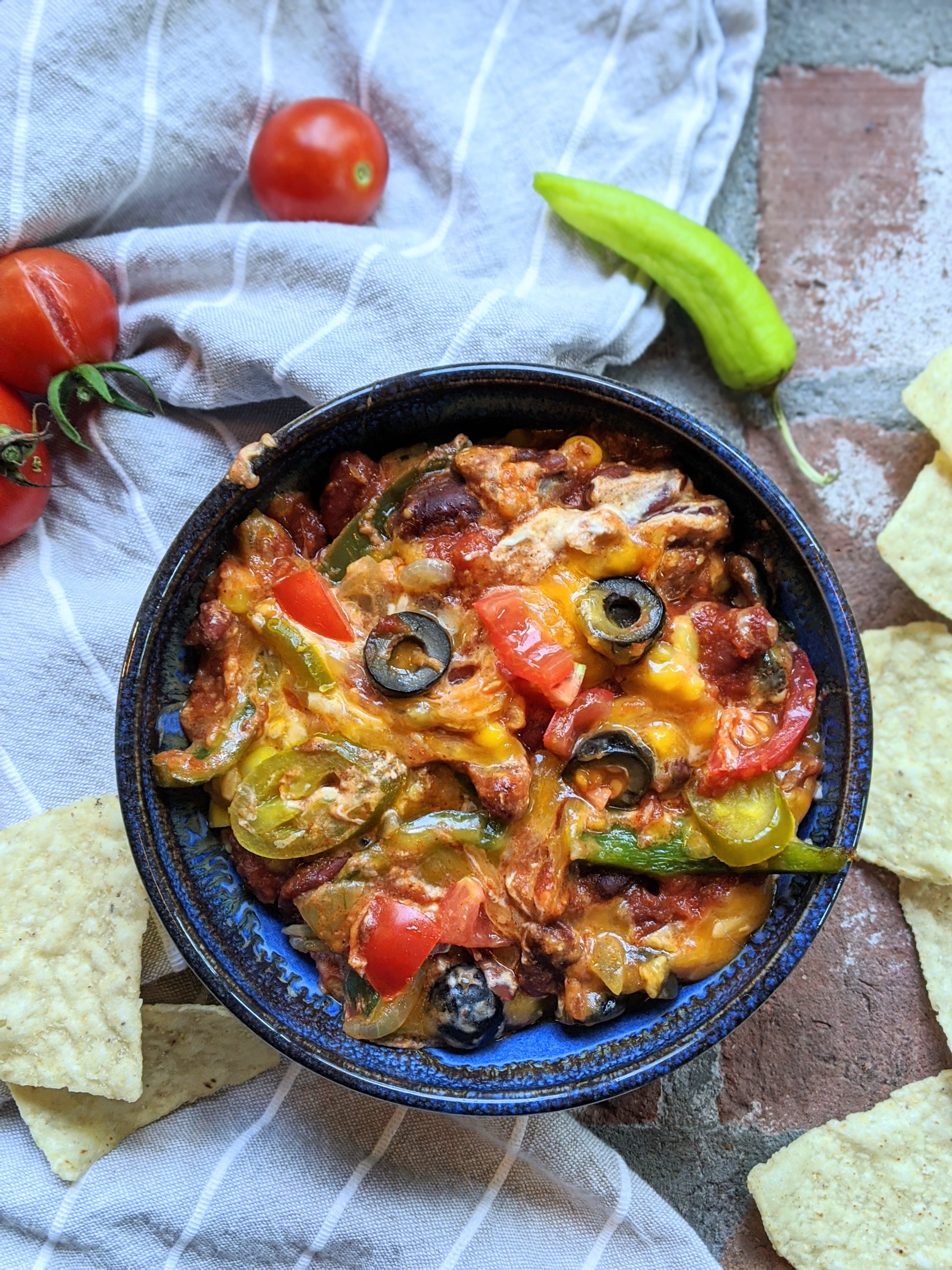 best vegan layer dipi recipe non dairy healthy high protein gluten free beans olives peppers onion vegetables tomatoes chilis cream cheese refried beans healthy homemade party food make ahead recipes