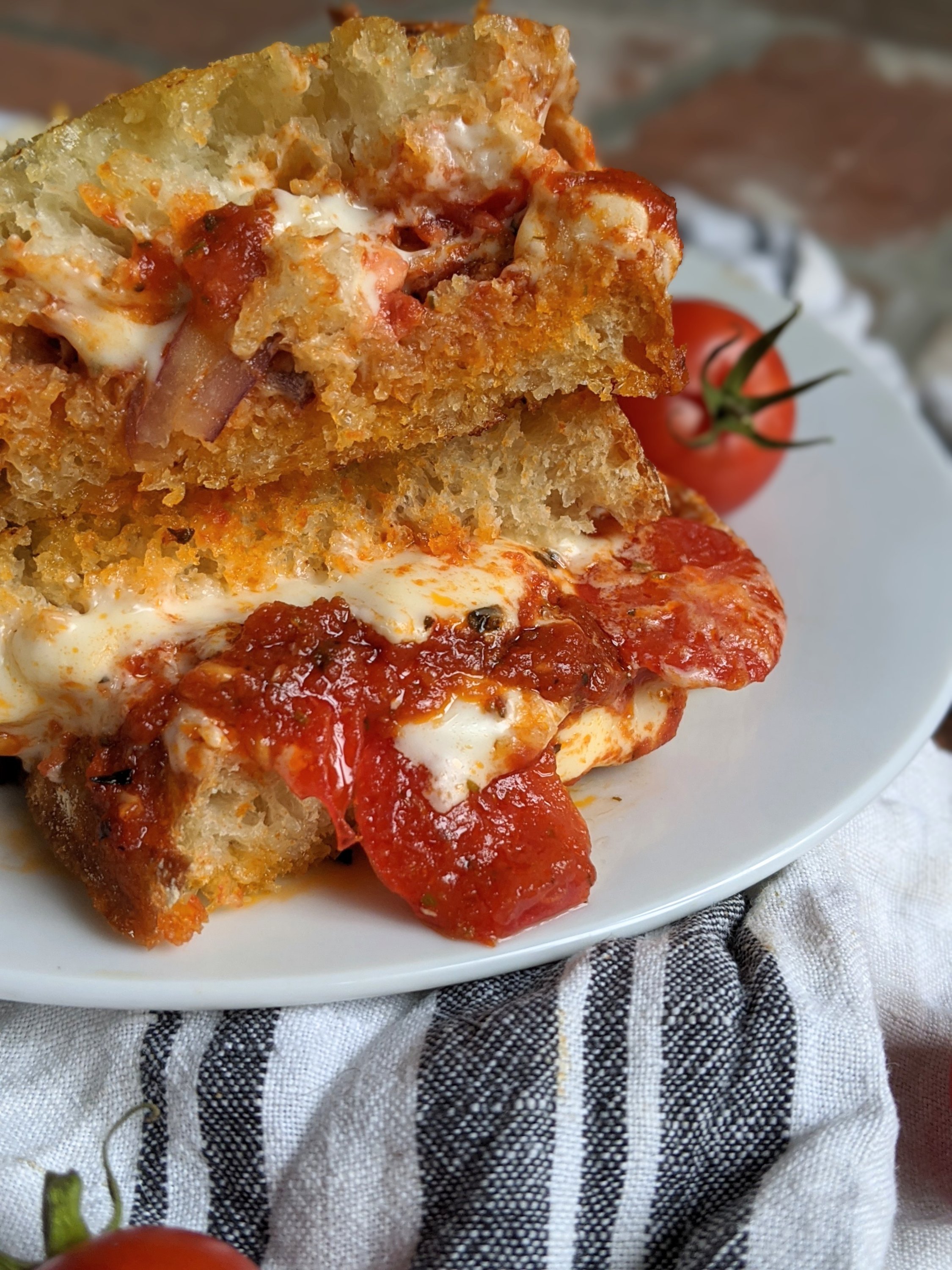 loaded pizza grilled cheese with pizza sauce tomatoes onions bell pepper and mozzarella grilled cheese