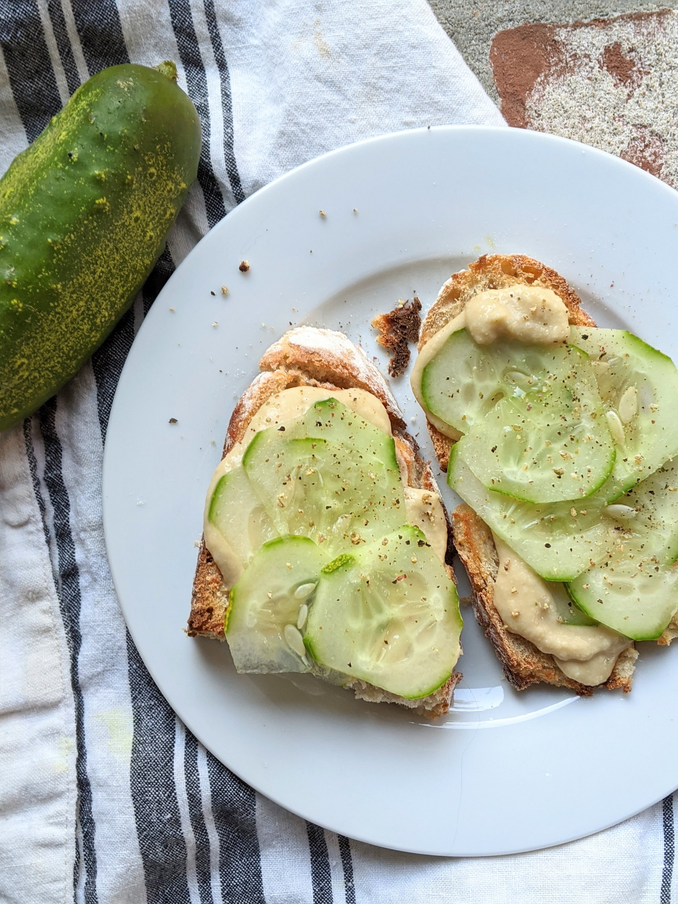 crunchy and fresh cucumber toast for breakfast with healthy hummus vegan breakfast ideas and recipes gluten free