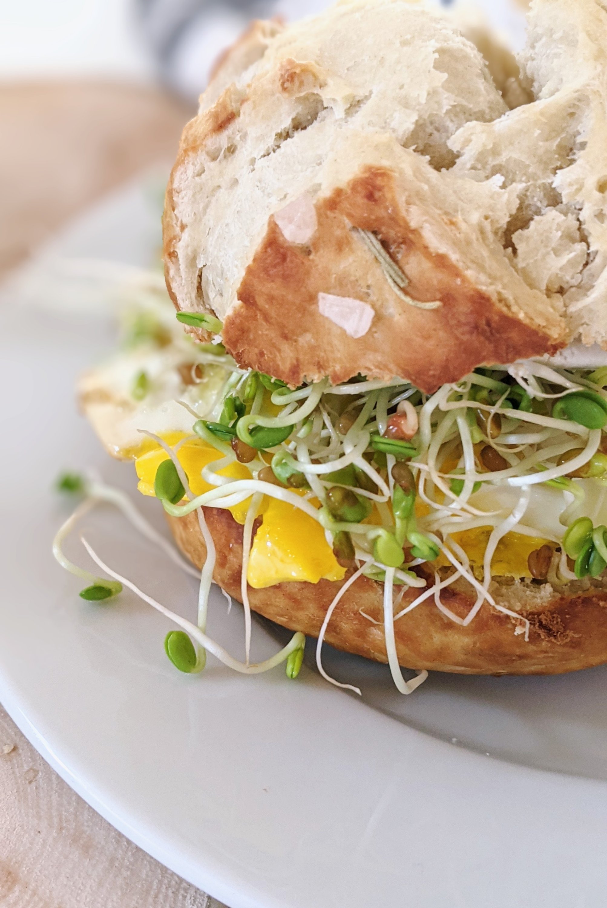 pretzel breakfast sandwich recipe with pretzel bread eggs sprouts and toppings for a breakfast bar ideas for weddings rehearsal dinners mother's day brunch ideas
