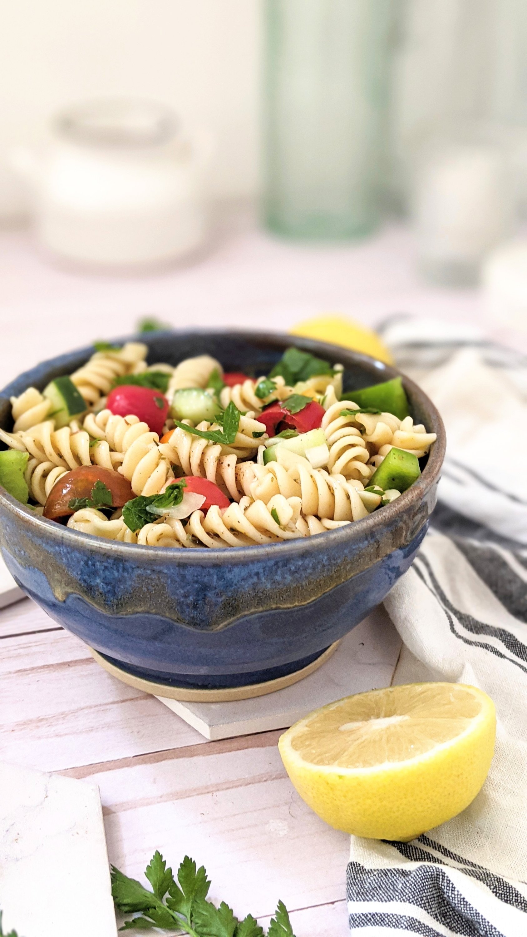 gluten free lemon herb pasta salad vegan vegetarian light summer side dishes healthy recipes with garden vegetables pasta salad with tomatoes bell peppers parsley and onion and cucumbers in a lemon vinaigrette dressing for pasta