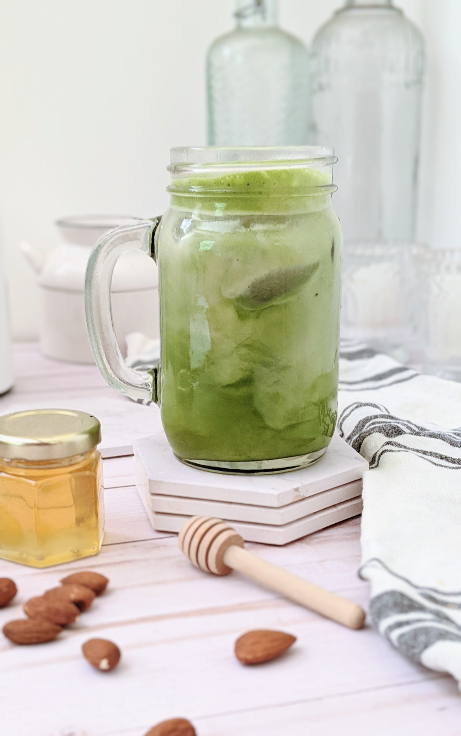 green tea matcha latte recipe dairy free with almond milk and raw honey in a mason jar with homemade vanilla honey almond milk and ice latte or hot matcha recipes