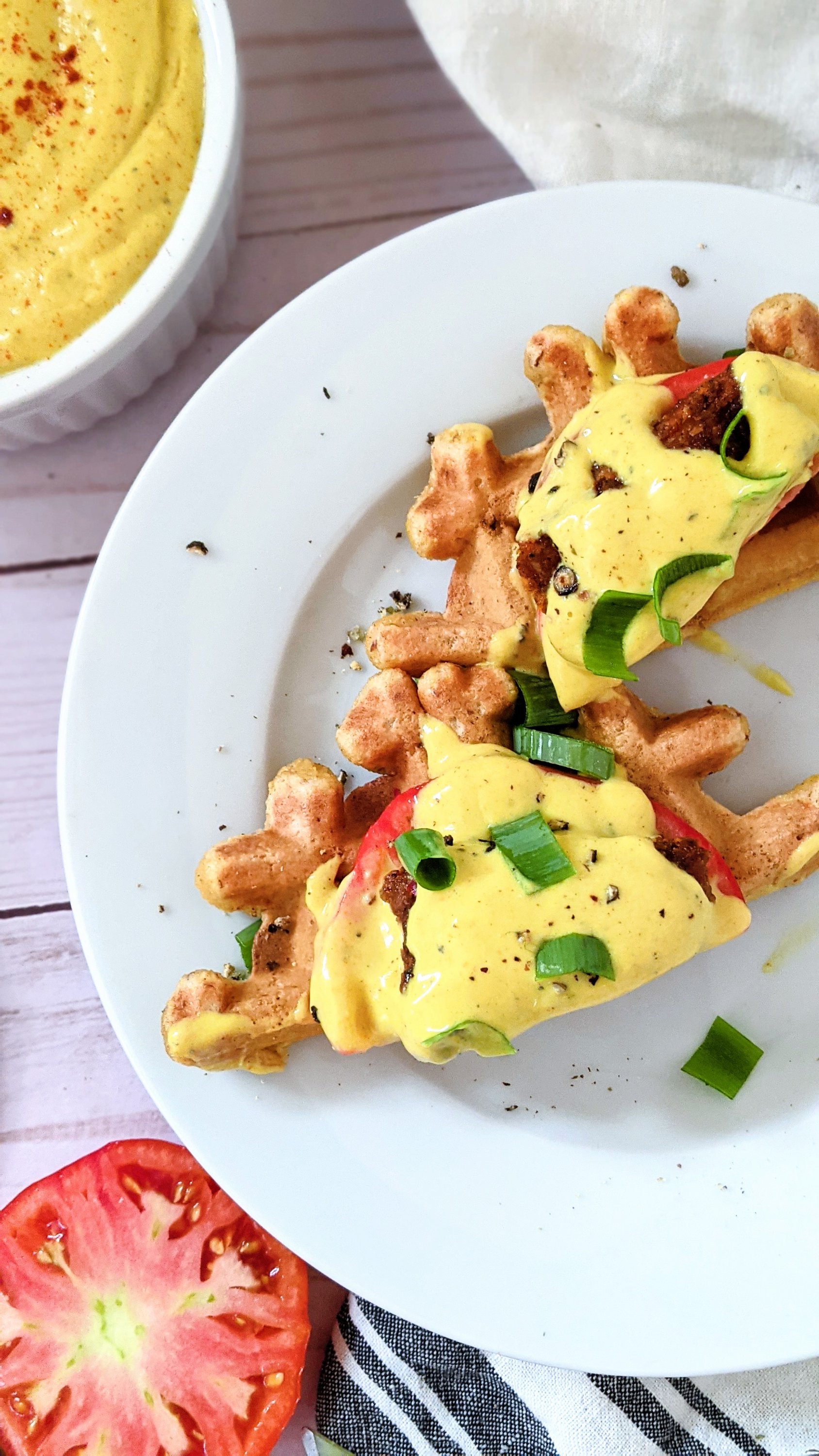 vegan waffle eggs benedict recipe on cornbread waffles vegetarian brunch recipes southwest spiced tofu on corn bread waffles with a chickpea hollandaise sauce and sliced tomato on eggs benedict vegan