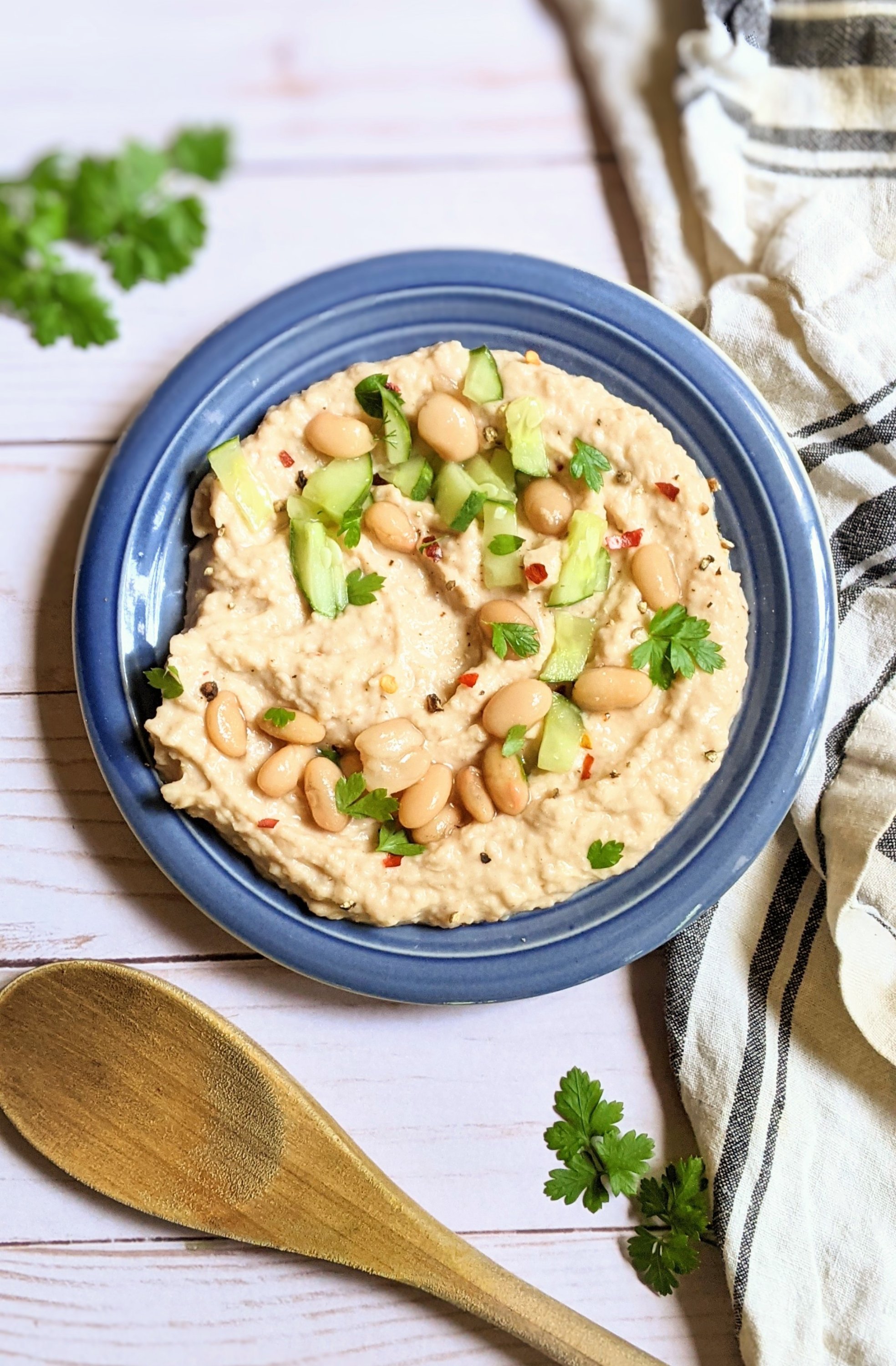 white bean hummus without oil vegan vegetarian and gluten free appetizers and side dishes without oil free hummus with beans and lemon juice and tahini and cucumber on top