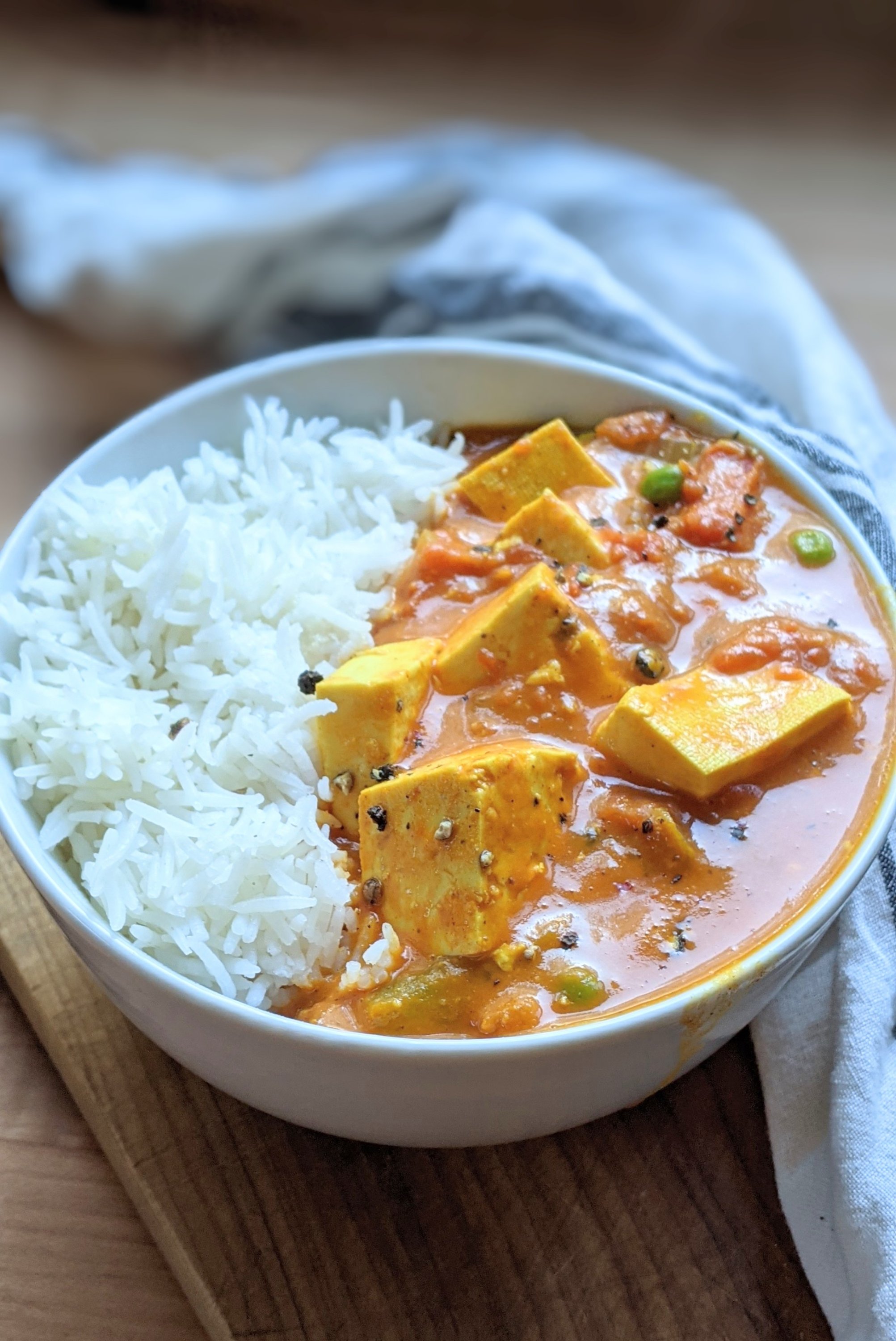 vegan indian tofu recipes todu du pyaza recipe in a bowl with basmati rice a creamy tofu curry with indian spices turmeric coriander seeds and peas