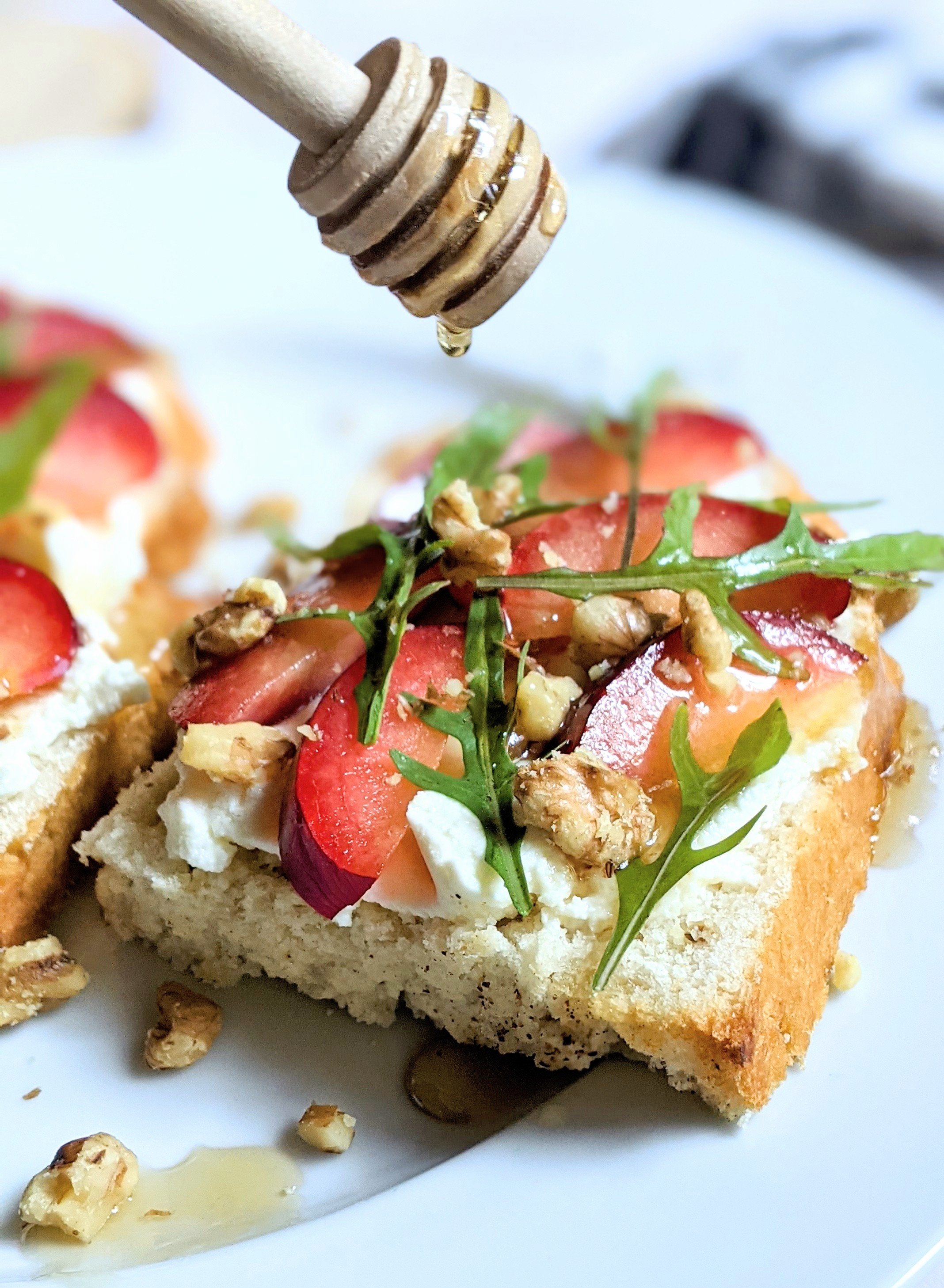 arugula toast with plums and ricotta fancy recipes for toast tuesday ricotta breakfast recipes with toasts and fruit stone fruit ricotta toast with arugula sweet and savory plum recipes