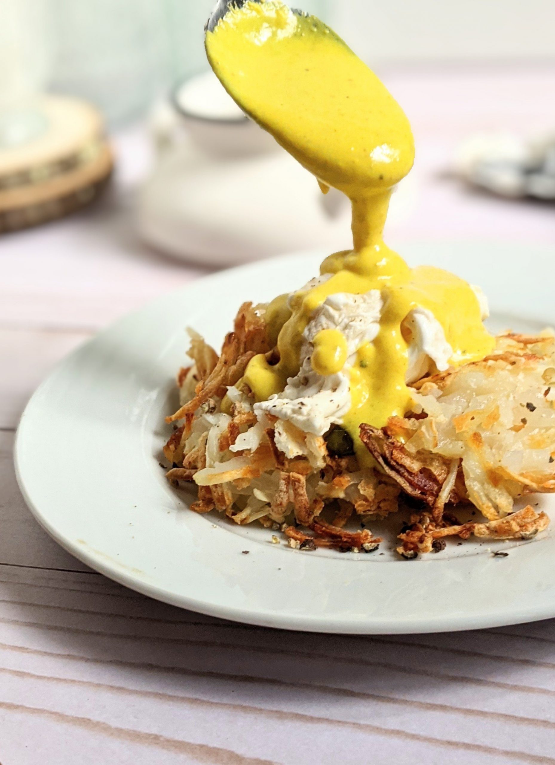 gluten free eggs benedict with hash browns potato egg benedict recipe without bread healthy fun eggs benedict non traditional recipes for breakfast and brunch store bought hollandaise sauce