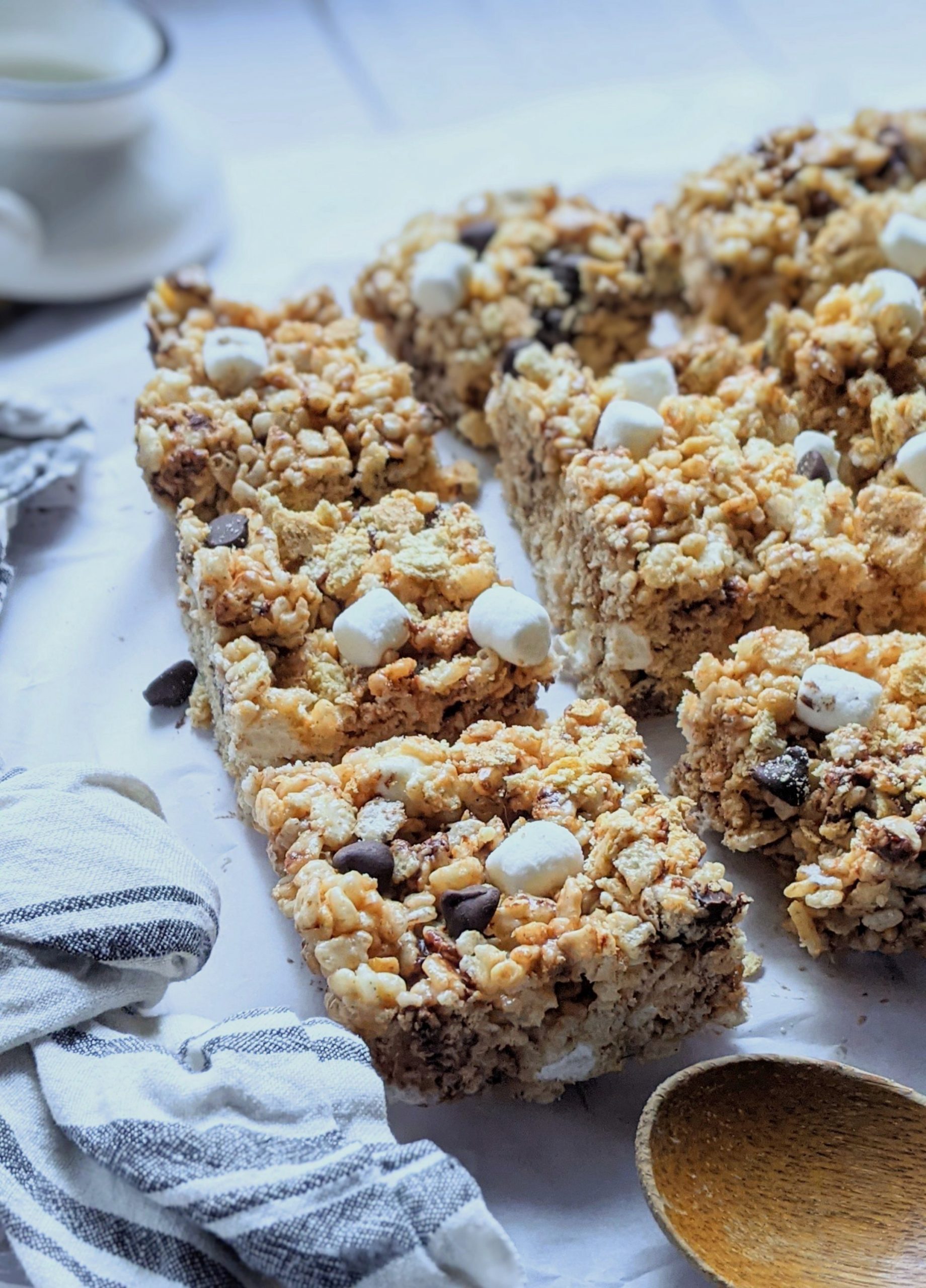 fun rice krispie treats with s'mores campfire marshmallow rice krispies treats milk chocolate and vanilla dessert bars with rice cereal summer desserts for a bbq party potluck dessert or cookout treats