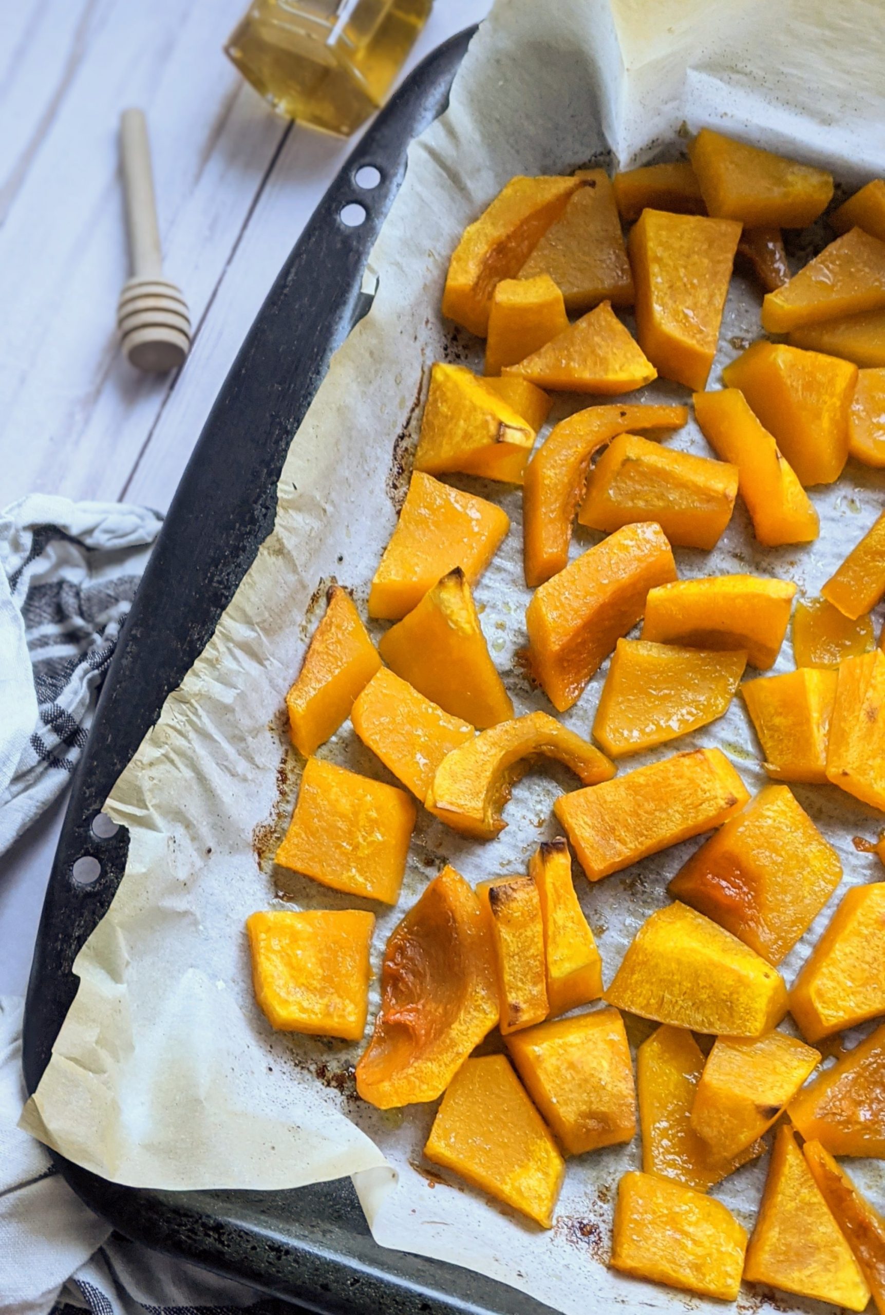 fall butternut squash recipes sweet roasted autumn squash with honey on a sheetpan with parchment paper