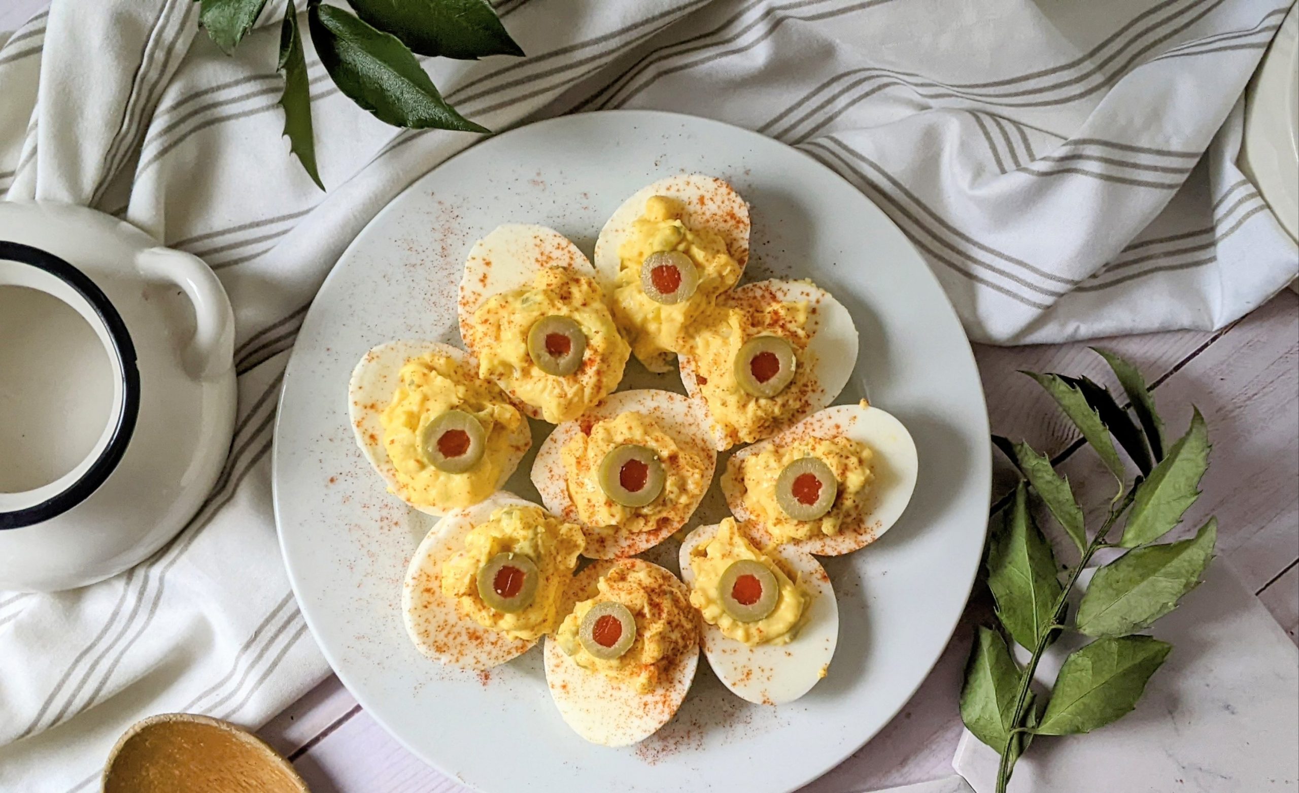 deviled eggs with green olives or greek olives mayonnaise dijon mustard paprika sweet pickle relish and mustard