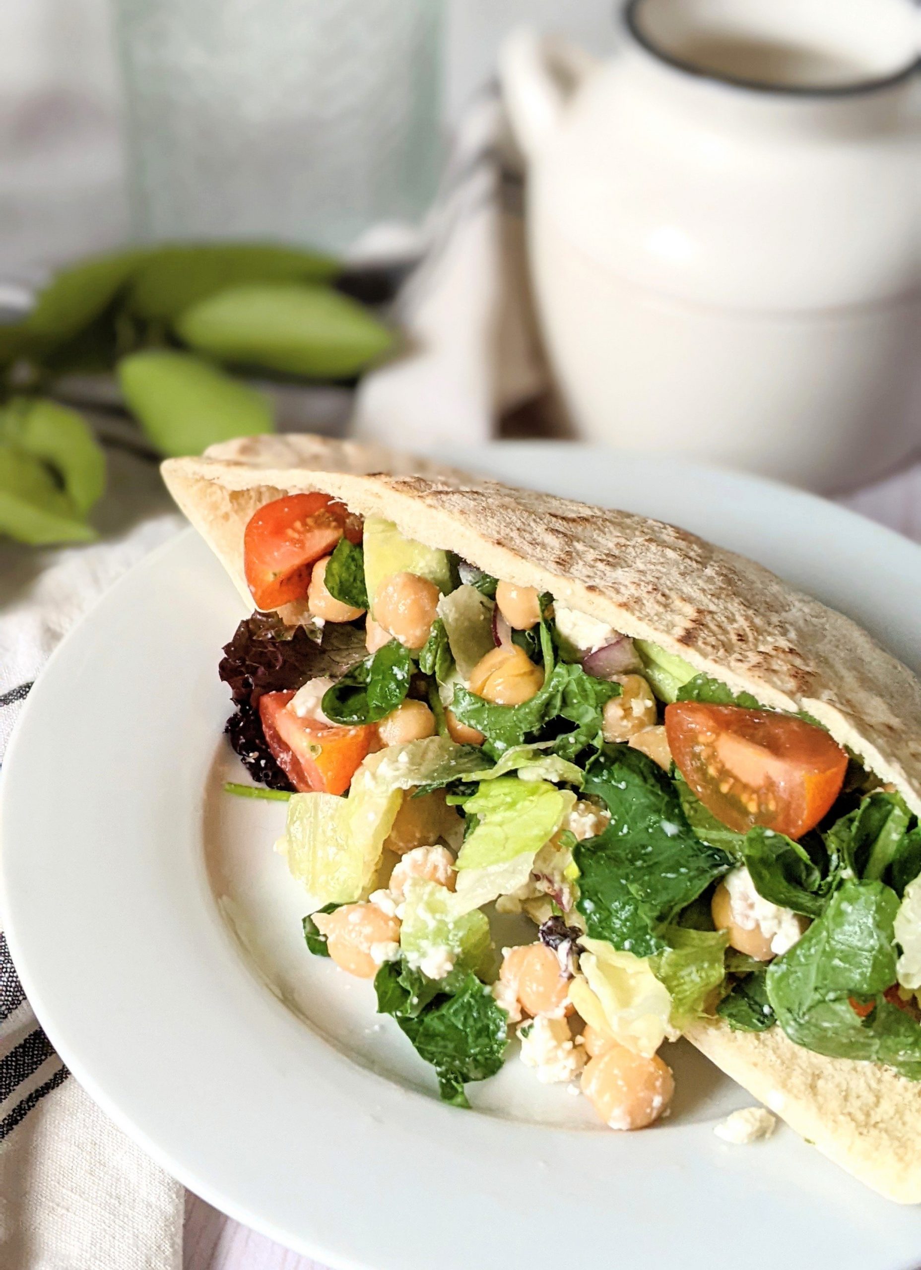 vegetarian chickpea pita wrap recipe with hummus greek hummos wrap with cucumber tomatoes feta cheese onion and red wine vinaigrette
