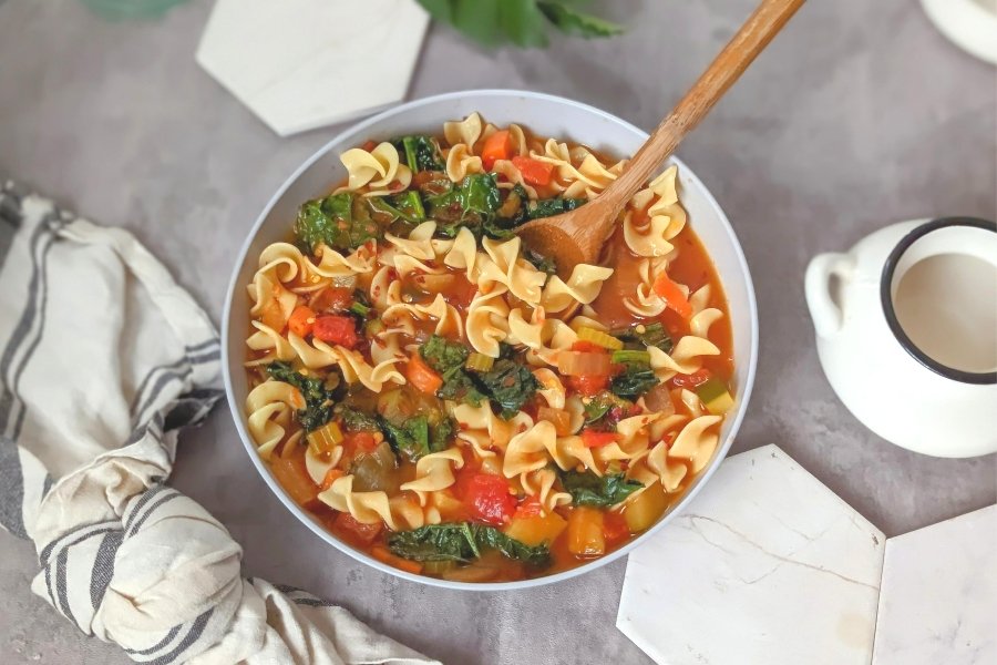 tomato vegetable noodle soup recipe with zucchini potatoes and hearty veggies that are high fiber and low sodium.