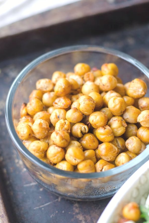 cooked chickpeas in a bowl for chickpea curry stew recipe with coconut milk and cilantro and cashews