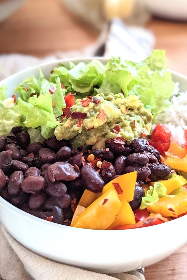 vegan taco bowl recipe with rice avocado red chili pepper flakes and mini sweet peppers on tacos