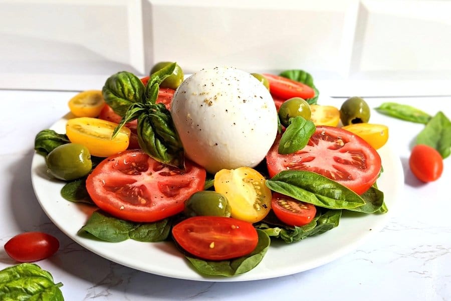 tomato burrata salad recipe with basil tellicherry pepper cheese and Castelvetrano olive salad recipe