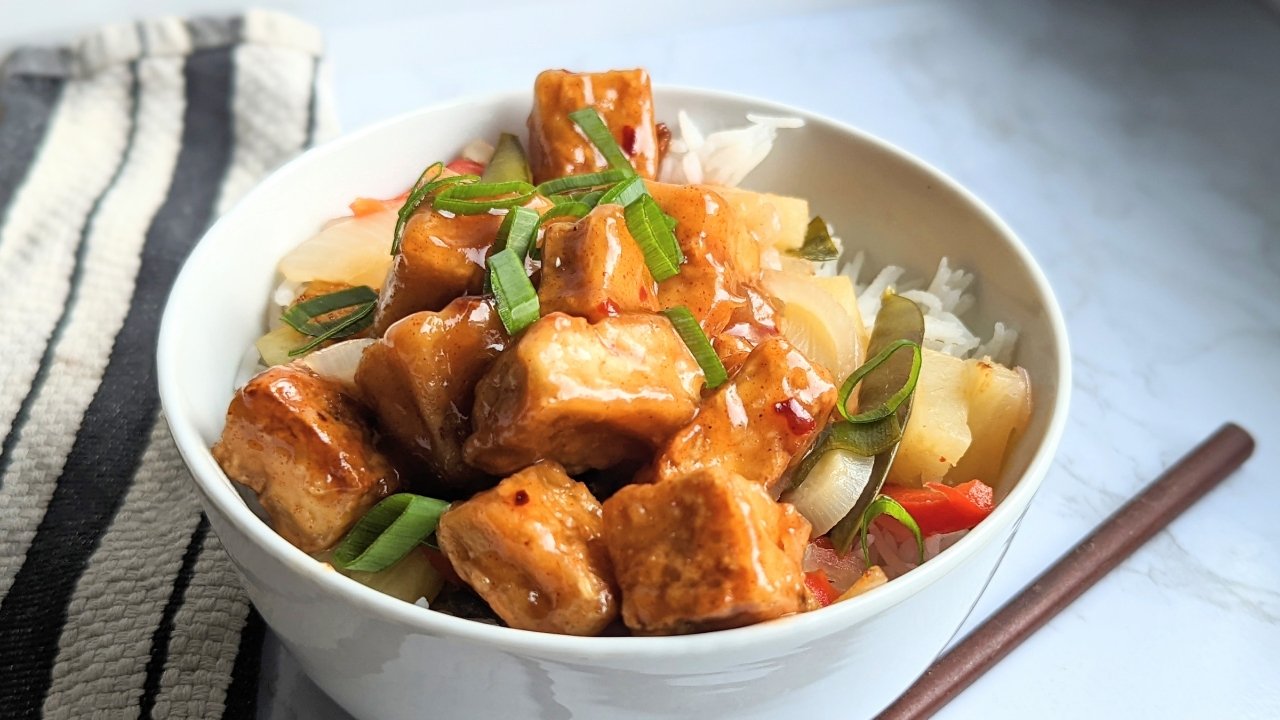 sweet sour tofu recipe crispy pan fried tofu with a thick sweet and sour sauce made from pineapple juice and served with rice and vegetables