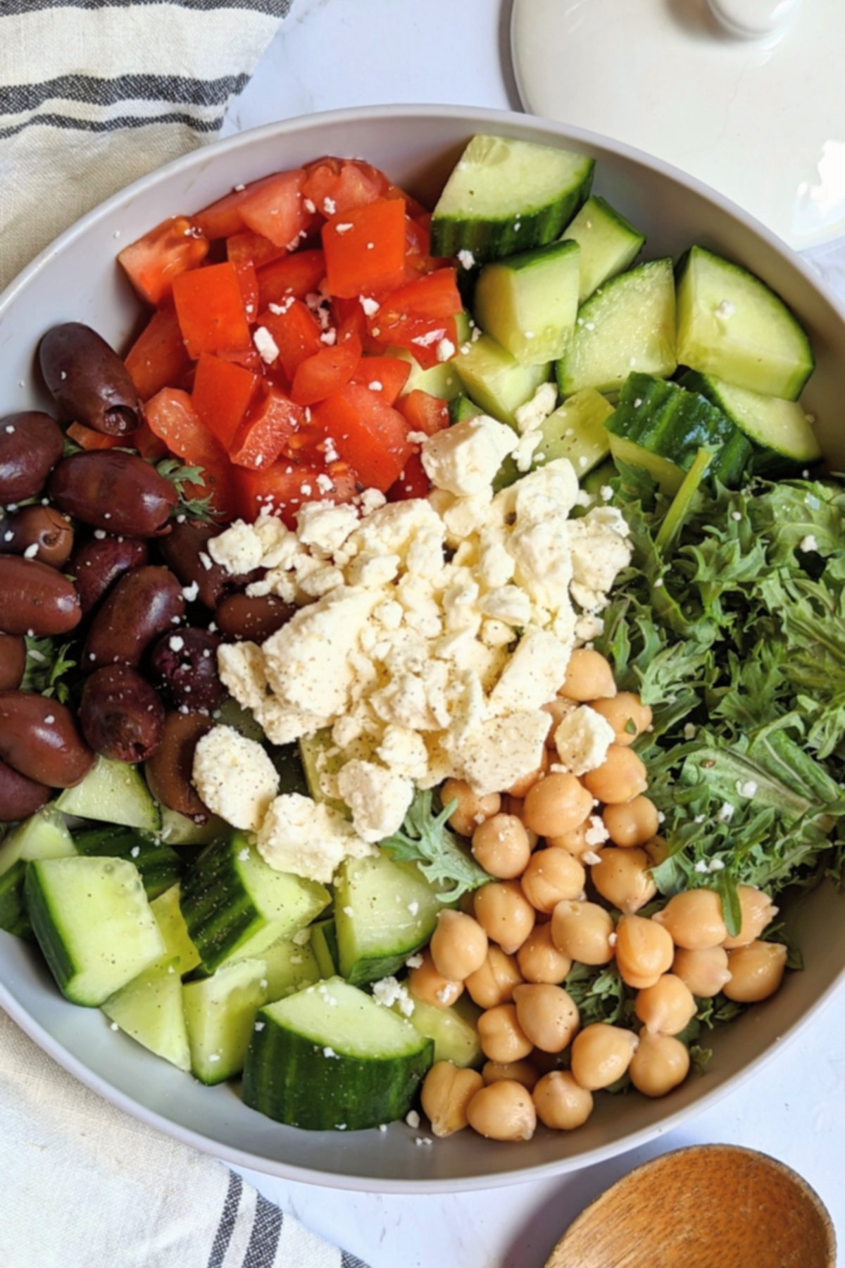 tomato cucumber feta salad with chickpeas kale or spinach and kalamata olives vegetarian gluten free easy lunches filling salad recipes