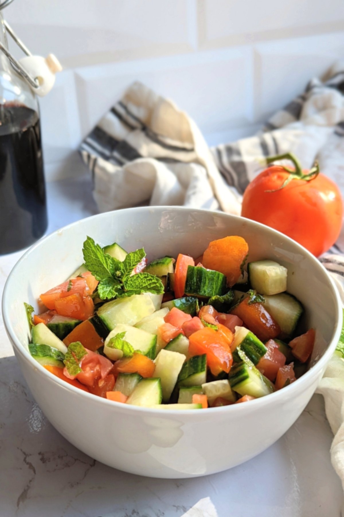 cucumber mint tomato salad recipe with olive oil red wine vinegar oregano sugar and fresh mint leaves no cook summer salads with cucumbers and tomatoes