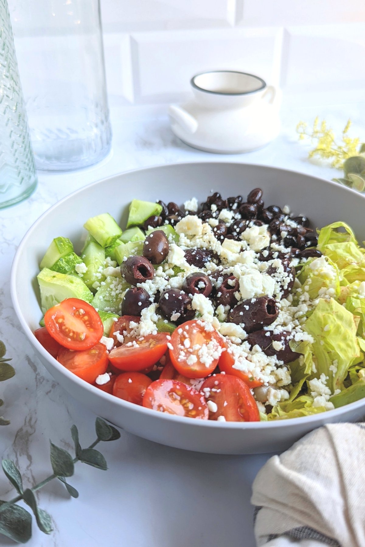 black bean salad with vinaigrette dressing and tomatoes cucumbers olives and romaine lettuce no cook lunch salad recipe with protein vegetarian gluten free