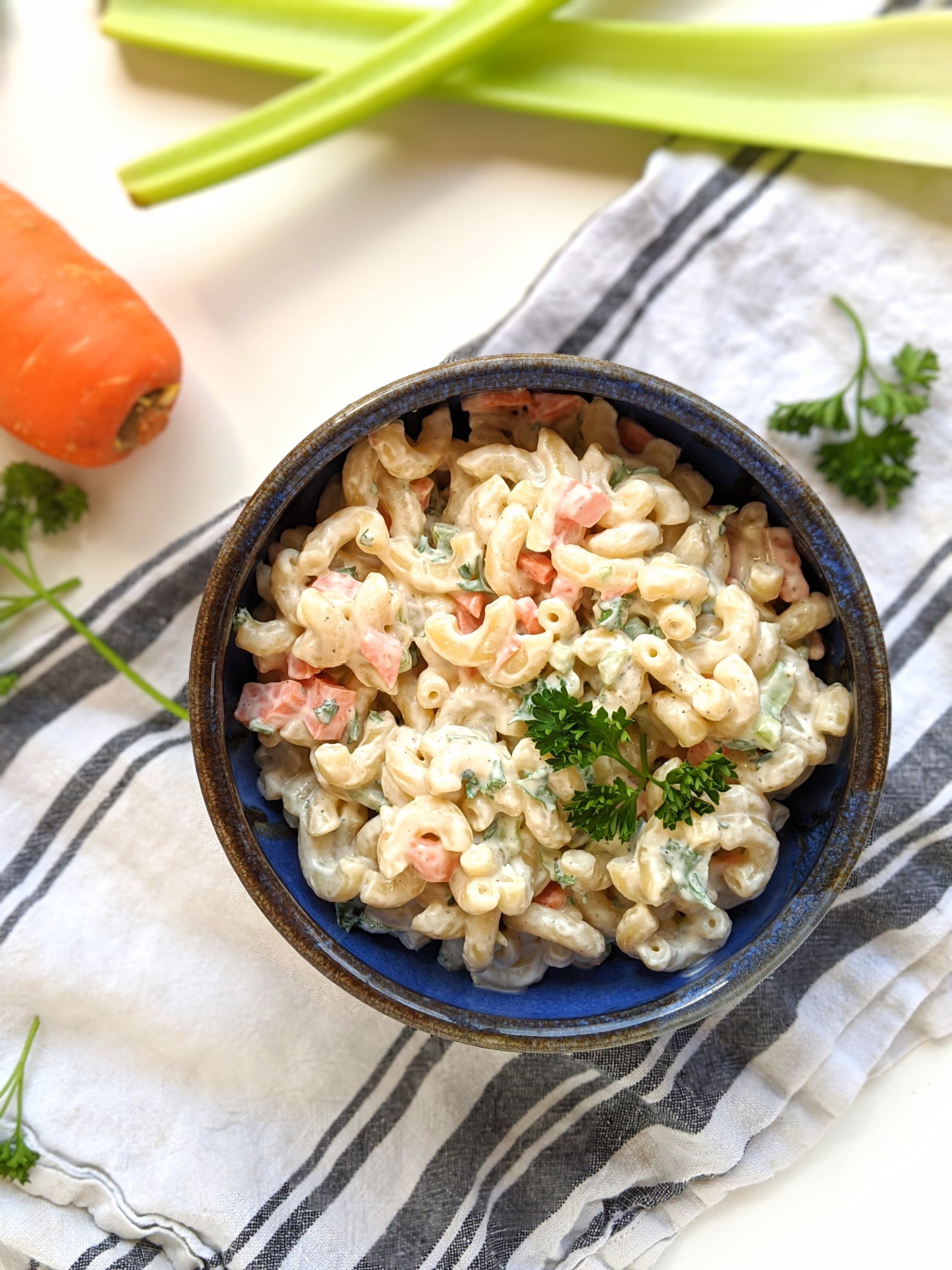 macaroni salad with greek yogurt carrots celery mac noodles pickles and parsley healthy mac salad vegetarian or vegan