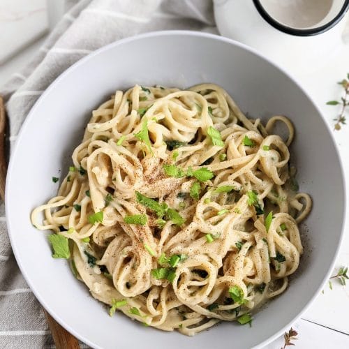 vegan alfredo recipe with oat milk plant based no cheese alfredo with garlic sauce and fettuccine noodles healthy italian dinners to make at home creamy vegan pasta