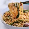 vegan peanut noodles with kale recipe spicy vegan sriracha sauce and peanuts vegetaables gluten free easy homemade weeknight dinner ideas