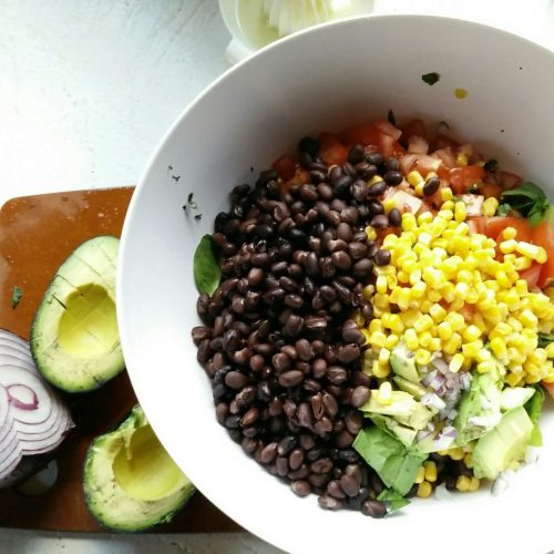 taco tuesday salad with avocado black beans corn red onion and a lime vinaigrette healthy spinach salads southwest dressing vegan vegetarian gluten free meatless side dishes with tacos