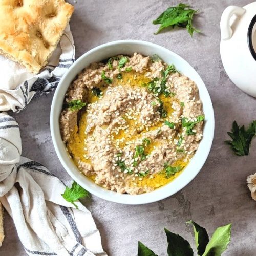 garlic eggplant dip recipe vegan gluten free with fresh chopped parsley and herbs and focaccia bread on the side to dip.