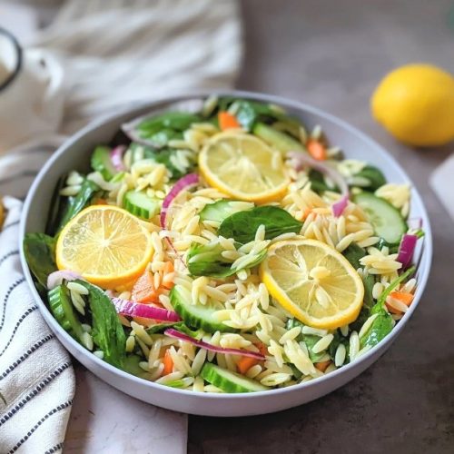 lemon pasta salad with cucumber onion spinach and a lemon dressing with vinaigrette healthy vegan pasta salad with orzo noodles.