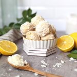 lemon energy bites recipe with shredded coconut balls recipe snacks healthy coconut recipes with shredded or flaked coconut in a dish with lemons and a wooden spoon on the table.