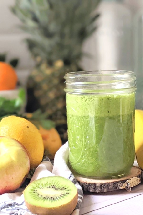 green goddess smoothie with spinach pineapple mango kiwi banana and oranges for a healthy gluten free breakfast recipes.