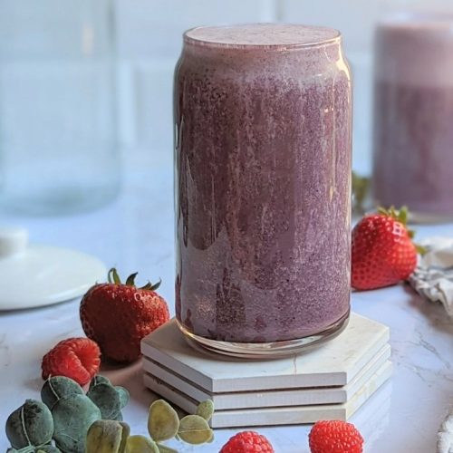strawberry protein smoothie with blueberries using fresh or frozen berry smoothies in a glass with fresh strawberries and fresh raspberries