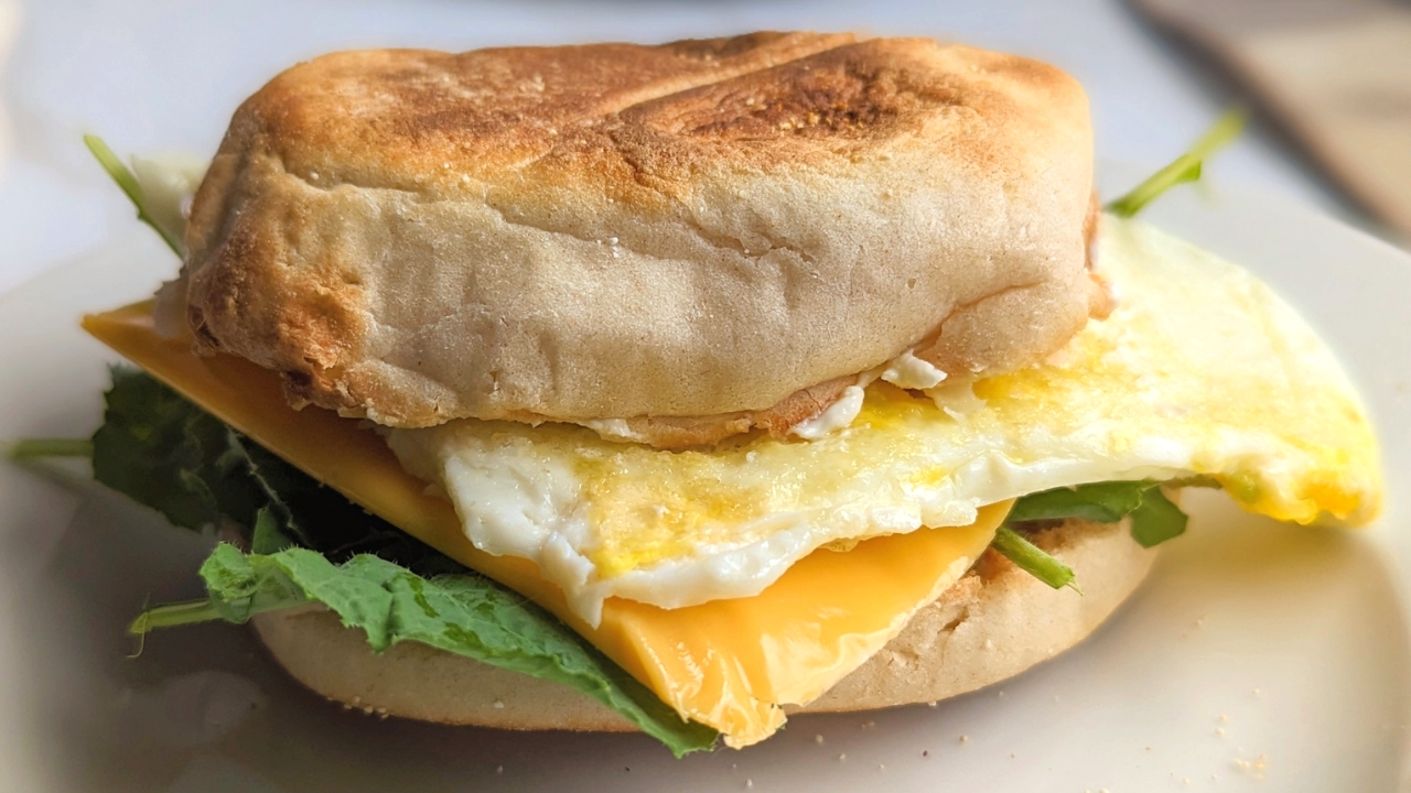 english muffin egg sandwich vegetarian brunch ideas for a crowd with cream cheese american cheese slices and spinach or kale meatless brunch sandwich