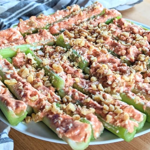 stuffed celery with cream cheese and chili sauce with walnuts on top family recipes for celery appetizers