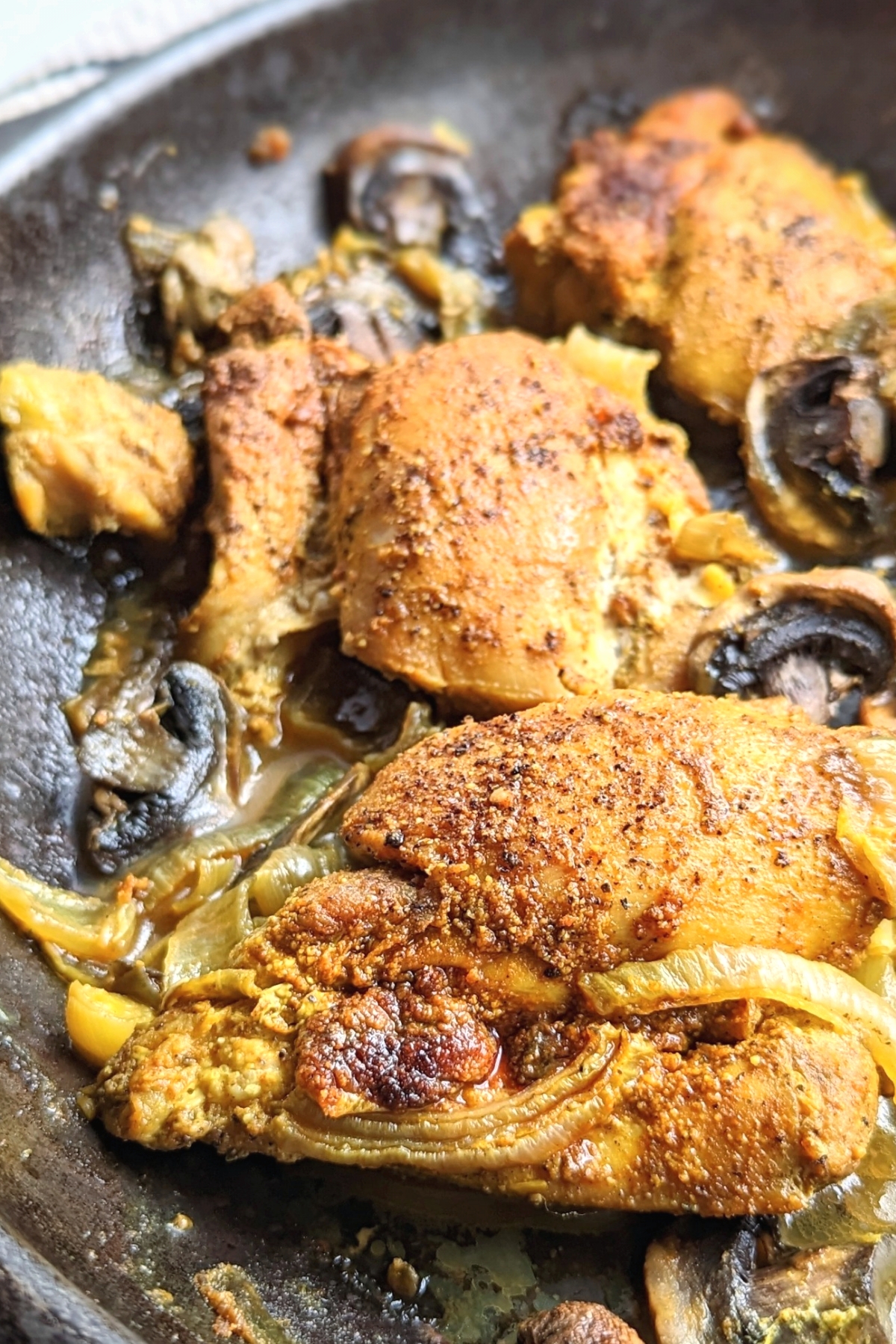 skillet chicken thighs in the oven chicken thighs with turmeric and black pepper cast iron skillet chicken in the oven recipe with onions and peppers