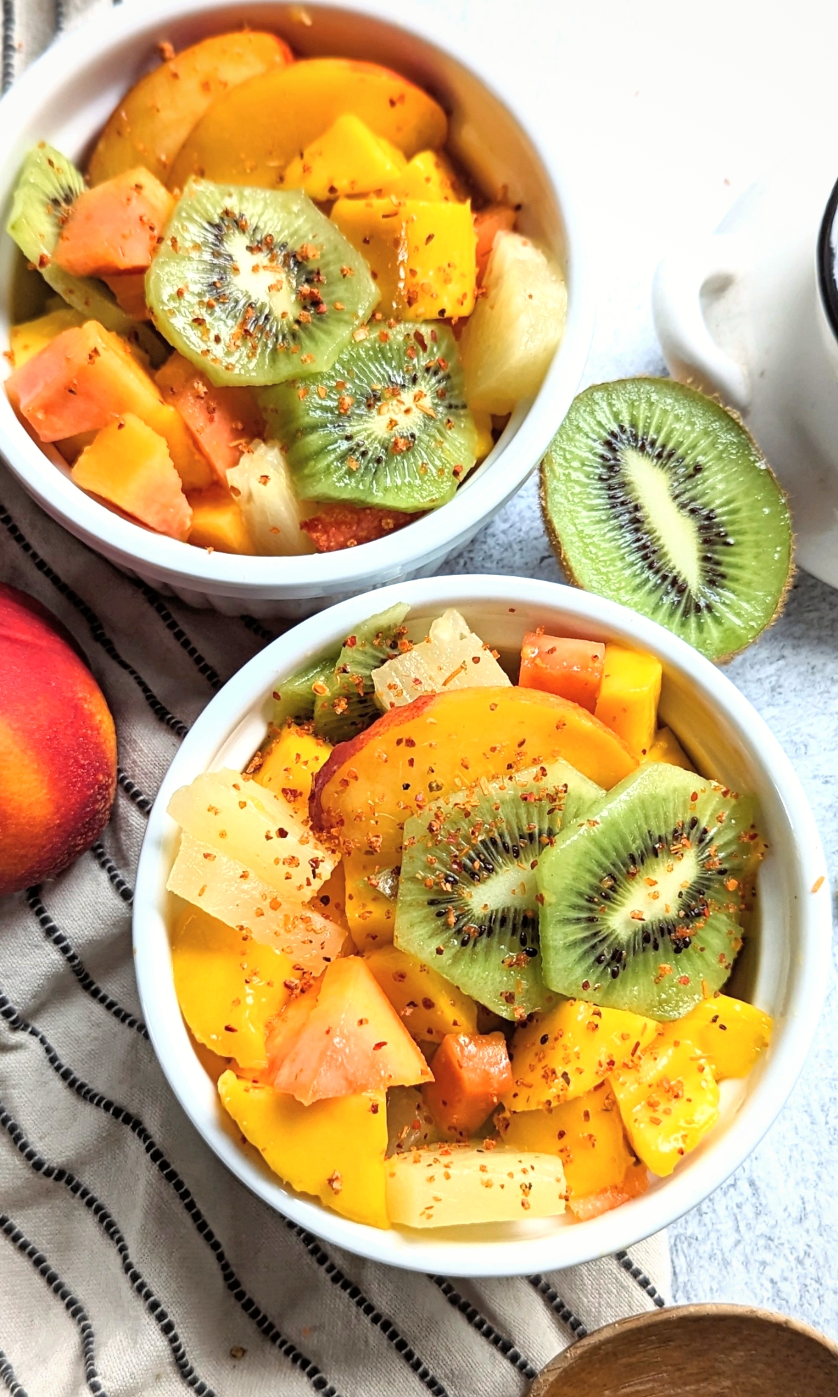 fruit with tajin chili lime fruit salad with mangoes kiwis peaches papayas and pineapples