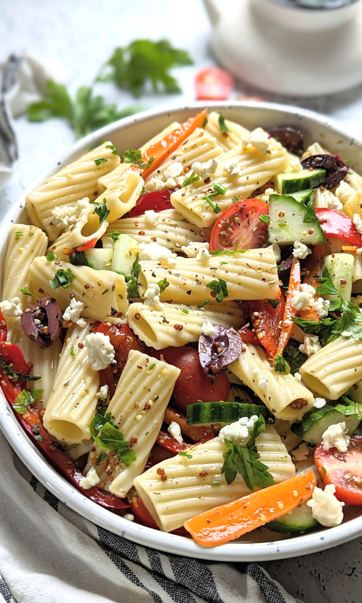 rigatoni salad with tomatoes feta cheese roasted red peppers carrots and olives and cucumbers with a homemade greek vinaigrette