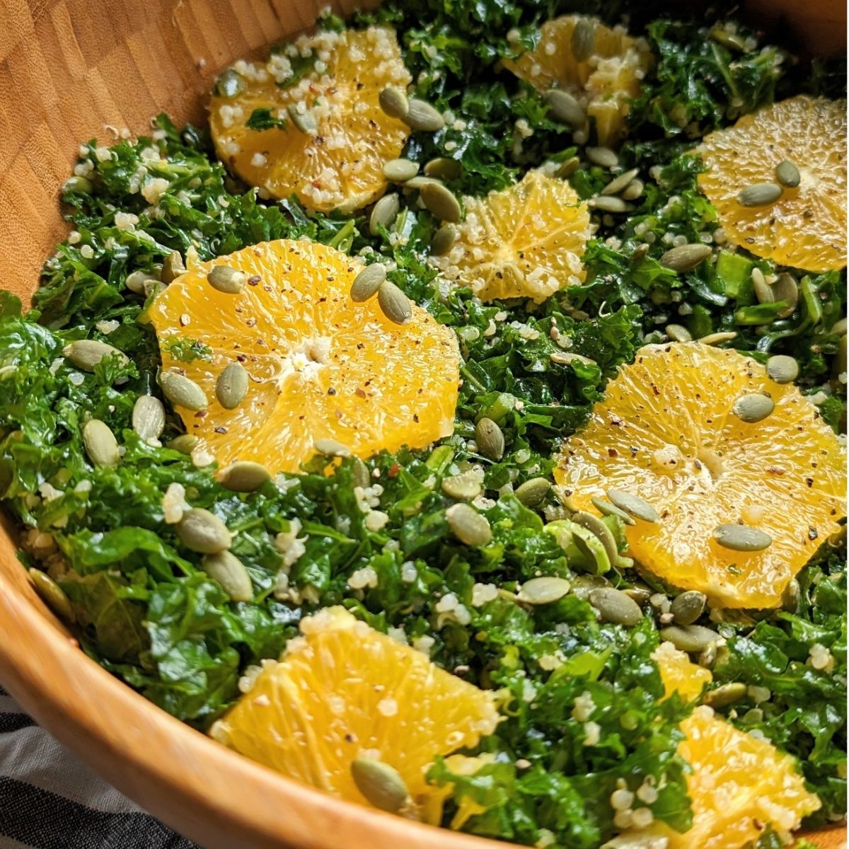 the best vegan kale salad recipe with oranges and quinoa with a homemade dressing