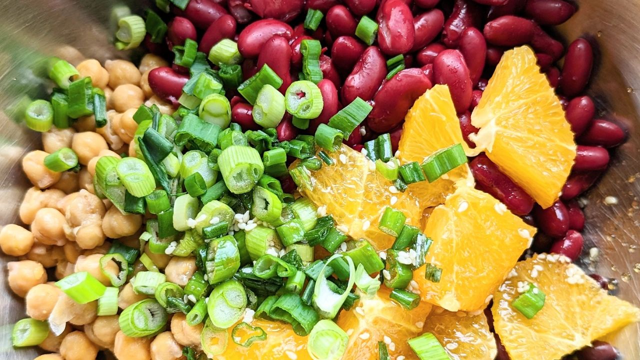asian 3 bean salad with green onions kidney beans oranges chickpeas or garbanzo beans and black beans