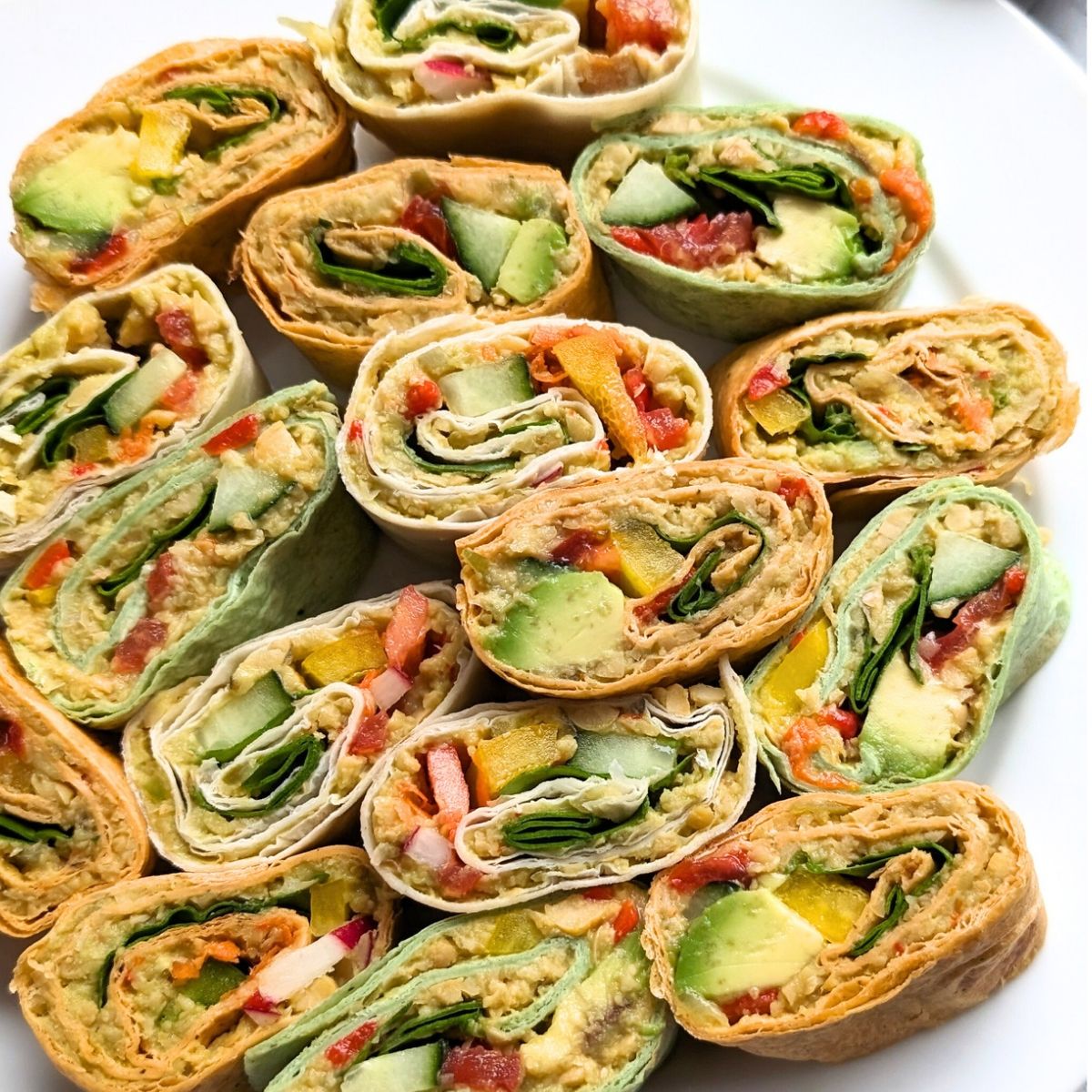 vegan pinwheels recipe with avocadoes chickpeas tomato and bell peppers