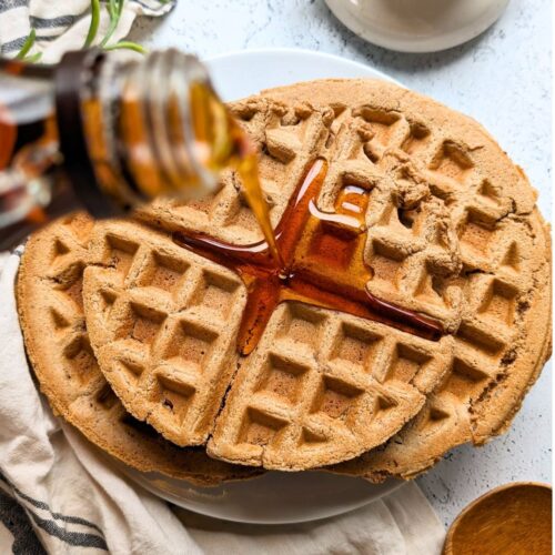 oat flour waffles recipe easy oatmeal waffles with poured maple syrup on top on a plate for breakfast or brunch