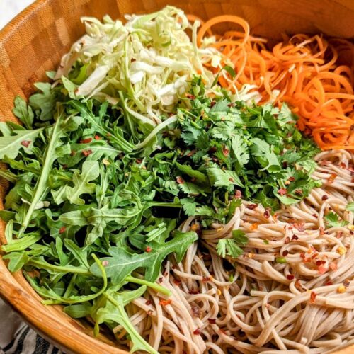 spicy soba noodle salad recipe with carrots arugula and cabbage