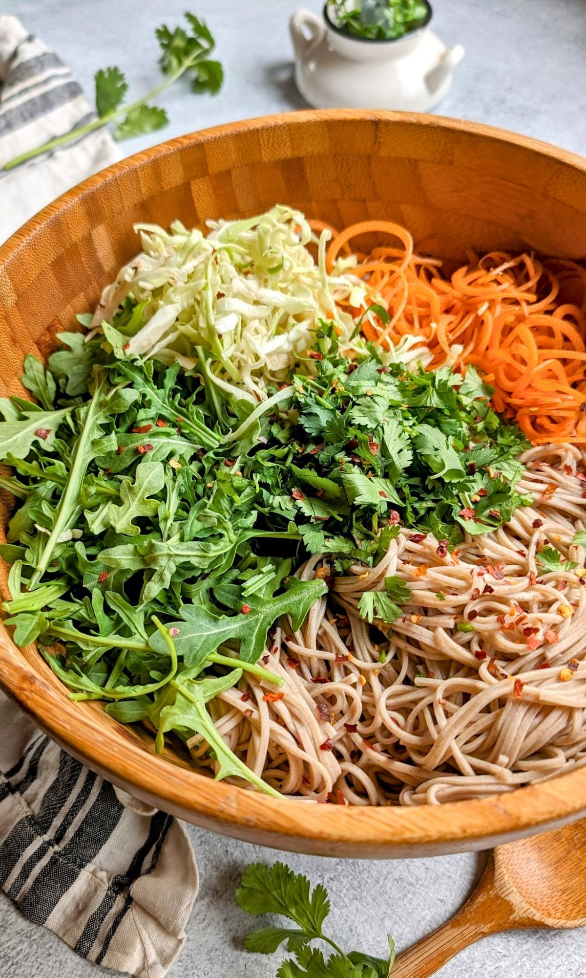 spicy soba noodle salad recipe with carrots arugula and cabbage