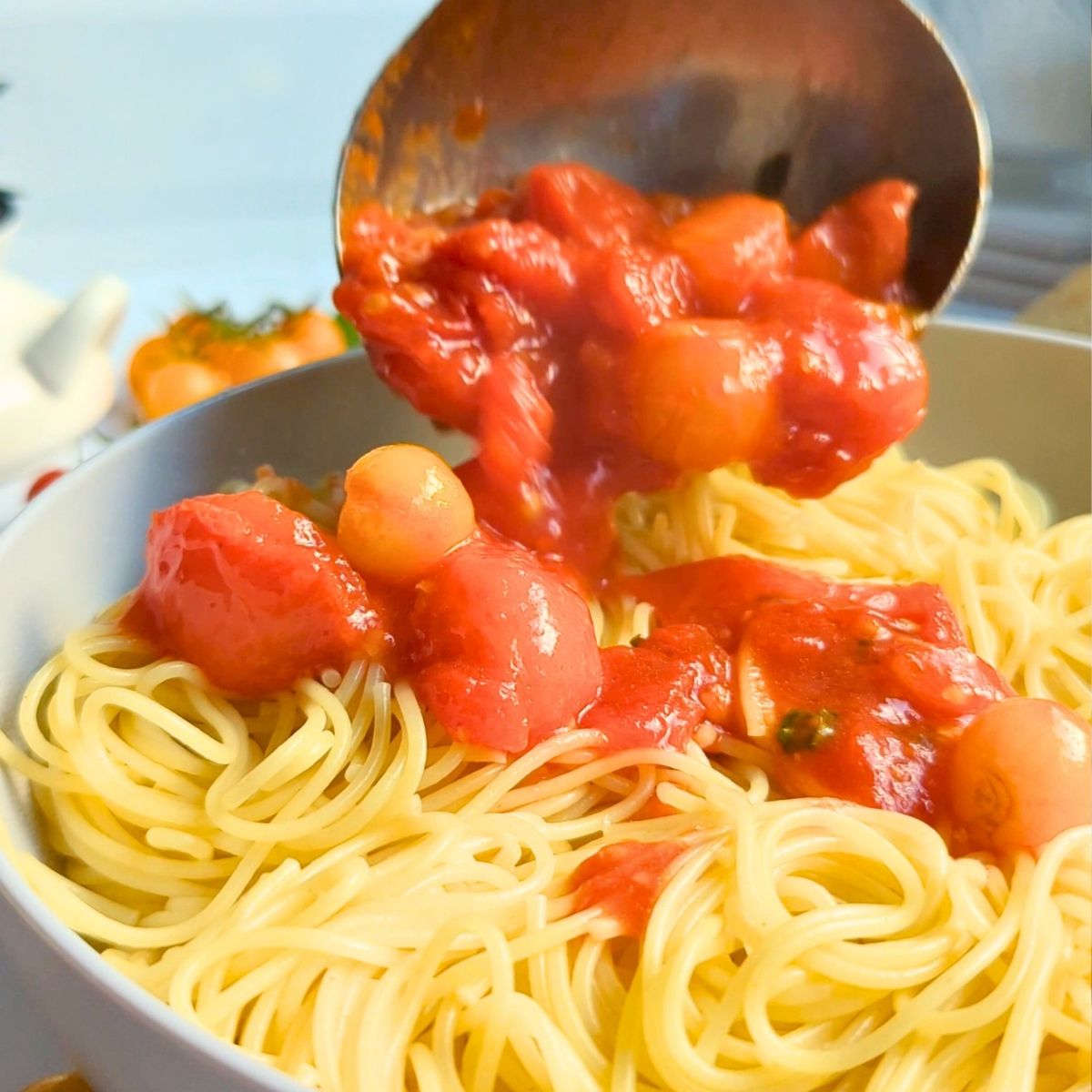fresh pomodoro sauce poured over cooked angel hair capellini pasta.