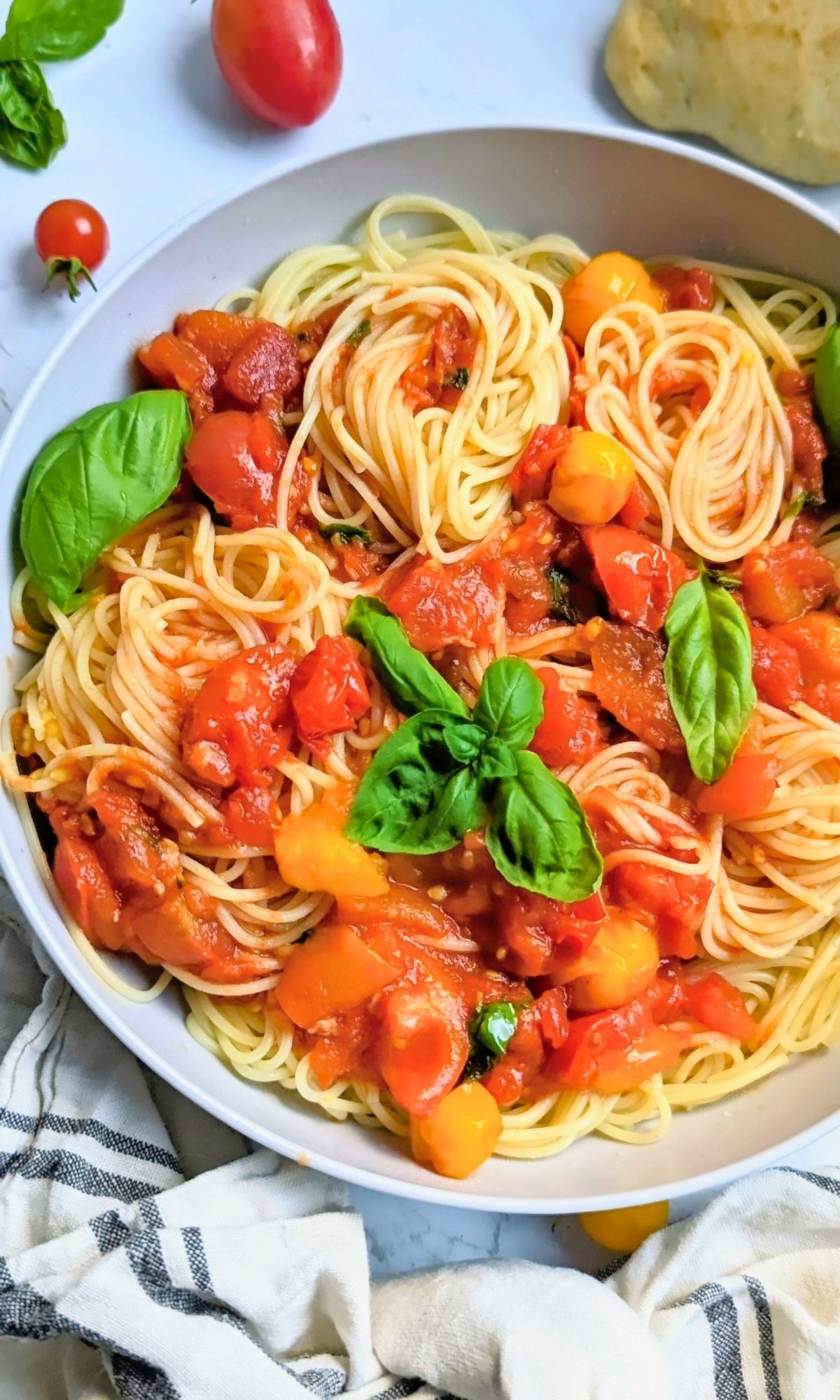 pomodoro pasta recipe healthy fresh tomato sauce with cherry tomatoes and basil tossed with capellini angel hair noodles for a vegan italian dinner