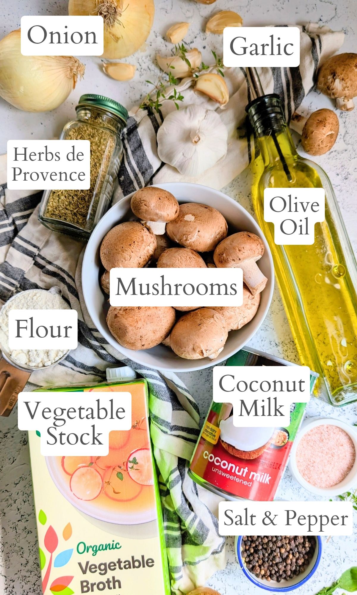 ingredints for coconut milk cream of mushroom soup like herbs de provence, coconut milk, vegetable stock, mushrooms, salt, and parsley.