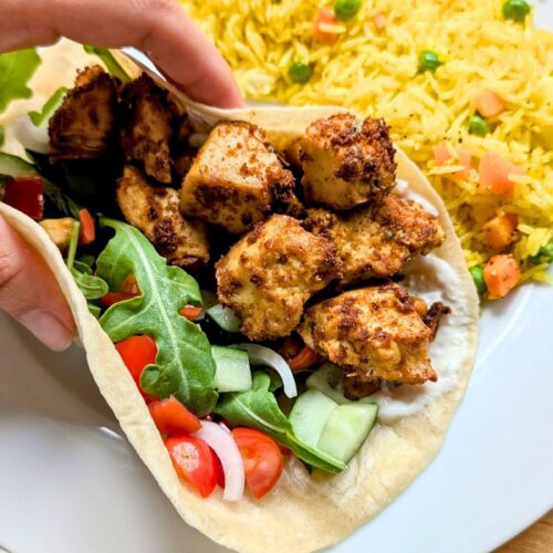 sheet pan shawarma with tofu vegan gluten free tofu wraps healthy plant based vegetarian shawarma wraps sandwiches with middle eastern spices and cucumber tzatziki creamy sauce shawarmas.