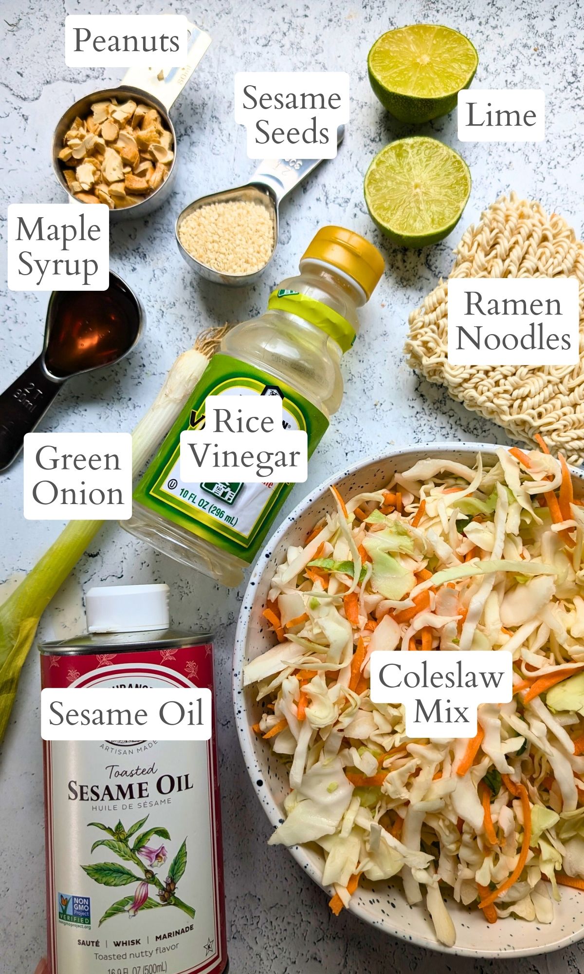 ingredients for coleslaw ramen noodle salad like rice vinegar lime juice ramen noodles toasted sesame oil and green onions.